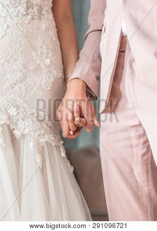 Married Couple Bride And Groom Holding Hands In Wedding Ceremony For Marriage Concept