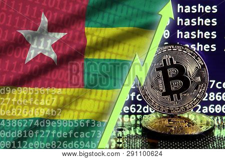 Togo Flag And Rising Green Arrow On Bitcoin Mining Screen And Two Physical Golden Bitcoins