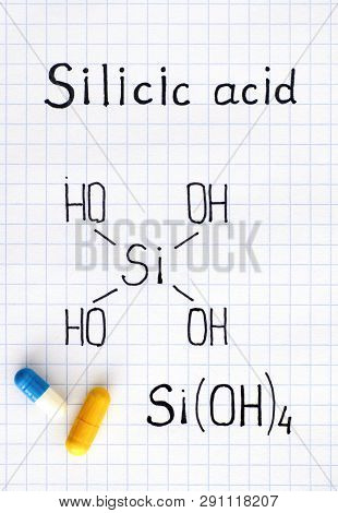 Chemical Formula Of Silicic Acid With Two Pills. Close-up.