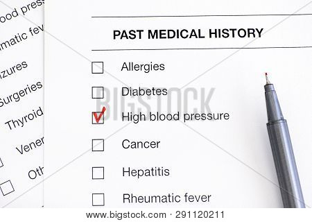 Past Medical History Questionary With Ticked High Blood Pressure And Pen. Close-up.