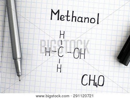 Chemical Formula Of Methanol With Black Pen. Closeup.