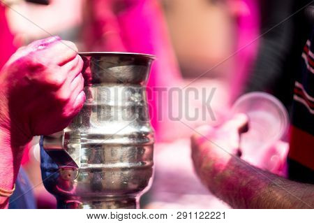 Colorful Hands Holding Disposable Cups Of Thandai On Hindu Festival Holi