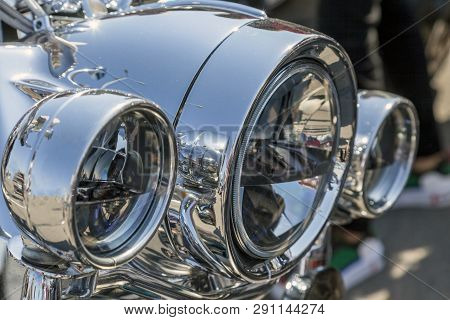 Chromed Headlamp Of A  Motorcycle, Stylish Classic Chrome-plated Motorcycle Headlight,close-up,