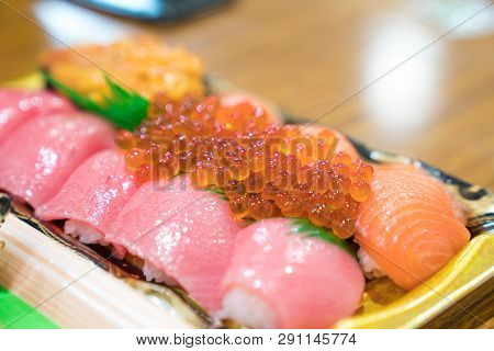 Sushi Salmon And Others Sushi Are Arranged In Foam Plant On The Table Ready To Eat At Kuromon Fish M