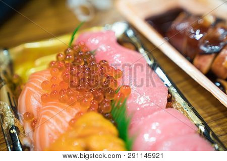 Sushi Salmon And Others Sushi Are Arranged In Foam Plant On The Table Ready To Eat At Kuromon Fish M