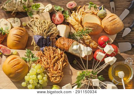Smoked Cheese Pigtail, Traditional Polish Smoked Cheese, Chechil Cheese On The Wood Background. Smok