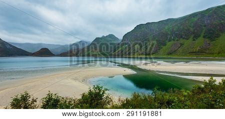 Lofoten Fjords And Lakes Cloudy Landscape With Sandy Beach, Lough, And Mountains (norway). Summer Po
