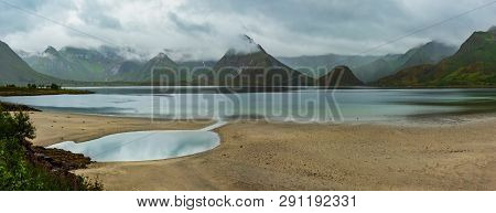 Lofoten Fjords And Lakes Cloudy Landscape With Sandy Beach, Lough, And Mountains (norway). Summer Po