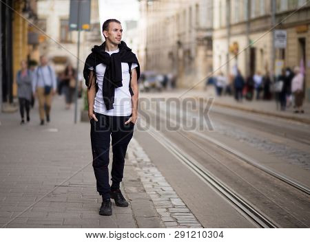 Young Traveler Man Walk Alone By Old Europen Street