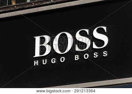 Hamburg, Germany - February 15, 2019: Logo And Sign Of Hugo Boss. Hugo Boss Is German Luxury Fashion