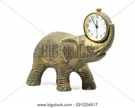 Isolated Bronze Anticue Elephant With A Clock On A White Background