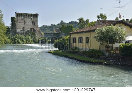 Old Fortress On River Mincio In Borguetto, A Ancient Village  In The Municipality Of Valeggio, In Th