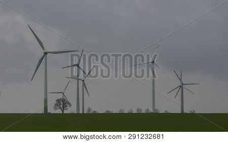 Wind Turbines Farm At Work In Fair Weather