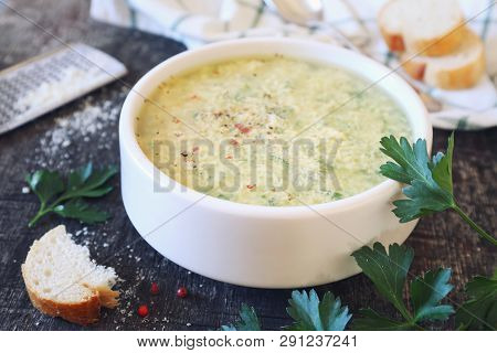 Italian Cuisine. Stracciatella Soup: Parsley, Eggs And Parmesan Cheese. Rustic Style