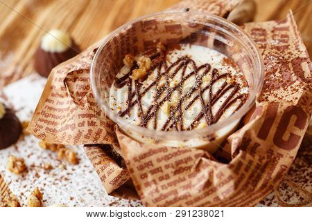 Italian Dessert Panakota With On A Wooden Background. Creamy Milk Tender Dessert In A Glass.