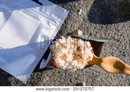 Cooking rice porridge. Cooking porridge on the street.