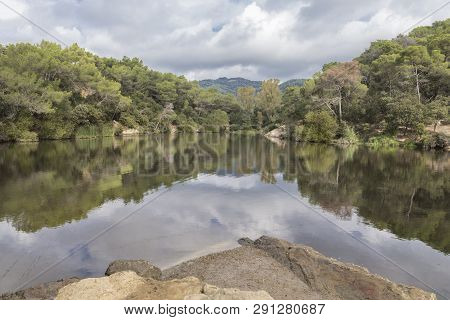 Small Lake In Terrassa, Barcelona, Spain In A Cloudy Day.