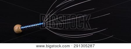 Device For Head Massage. Black Background. Orgasm. Relaxation.