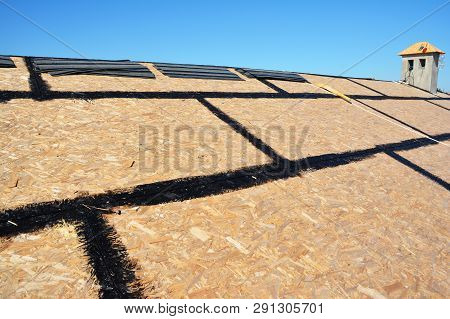 Roofing Construction With Asphalt Shingles Installation And Chimney Construction. House Roofing. Asp