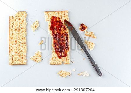 Pesach Celebration Concept. Matzah And Jam On White Table, Background For Jewish Passover Holiday. J