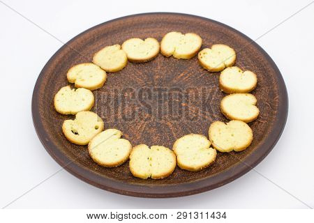 Bake Rolls. The Mini Bread Chips On The Brown Bowl. Isolated On White Background.