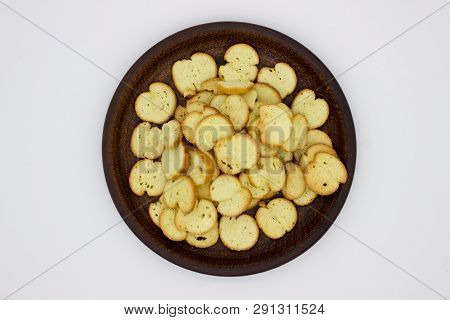 Bake Rolls. The Mini Bread Chips On The Brown Bowl. Isolated On White Background.