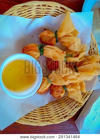 Thai Money Bag (thai Traditional Spring Rolls) Or Name Toong Tong With Plum Sauce