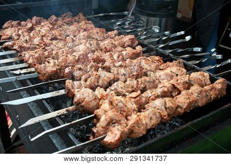 Close Up Of Some Meat Skewers, Grilled In A Barbecue, Shashlik Or Shashlyk Of Pork For A Pic Nic