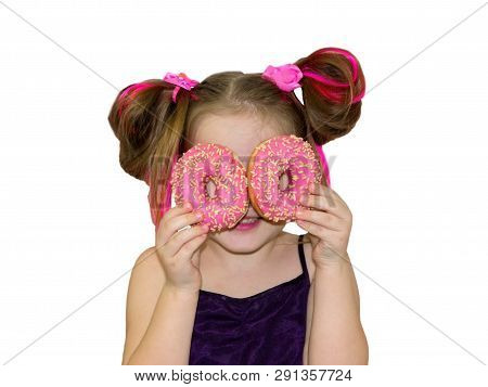 Little Happy Cute Girl Is Eating Donut On White Background Wall. Child Is Having Fun With Donut. Tas