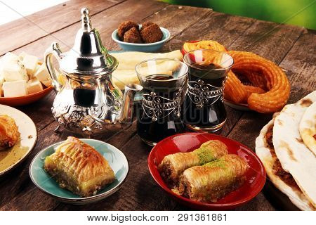 Middle Eastern Or Arabic Dishes And Assorted Meze, Concrete Rustic Background. Turkish Bread Or Turk