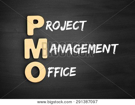 Wooden Alphabets Building The Word Pmo - Project Management Office Acronym On Blackboard