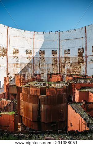 Inside Round Ruined And Abandoned Nuclear Rector Room In Crimean Destroyed Npp, Rusty Steel Equipmen