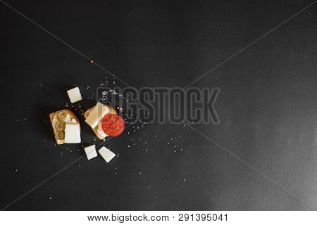Rusk Bread With Cream Cheese, Kasseri, Olives And Tomato.