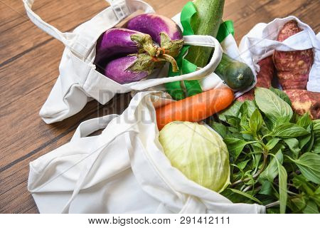 Zero Waste Use Less Plastic Concept / Fresh Vegetables Organic In Eco Cotton Fabric Bags On Wooden T