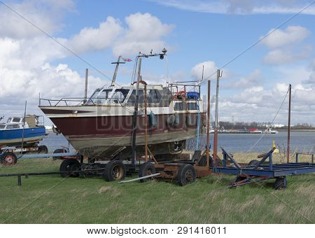 Old Boat On The Shore Ready For Restoration At The Port Of Doel