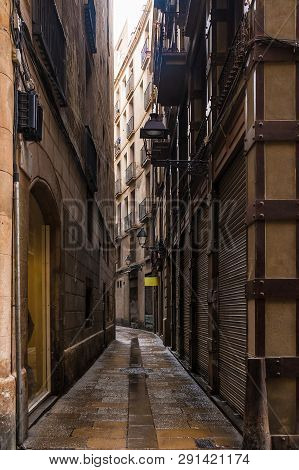 Perspective View Of The Narrow Street In The Gothic Quarter, Barcelona, Spain