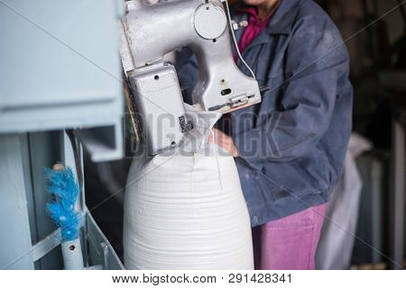 Work On The Production Of Agricultural Products. A Caucasian Woman Dressed In An Iniform Performs Wo