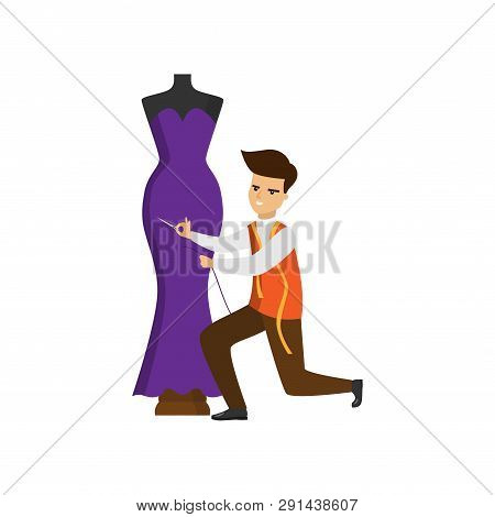 Tailor Standing On One Knee Hemming Purple Dress On Mannequin