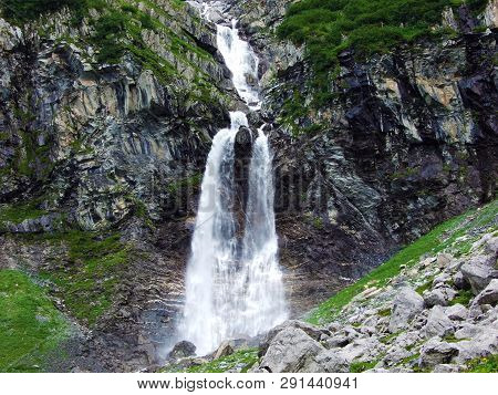 Nameless Waterfalls Under The Alpine Peaks Glarner Vorab And Bünder Vorab In The Valley Of Im Loch -