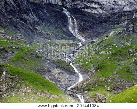 Nameless Waterfalls Under The Alpine Peaks Glarner Vorab And Bünder Vorab In The Valley Of Im Loch -