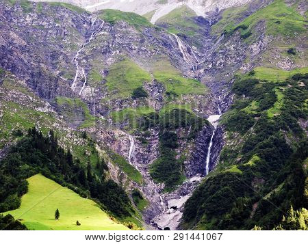 Nameless Waterfalls Under The Alpine Peaks Glarner Vorab And Bünder Vorab In The Valley Of Im Loch -