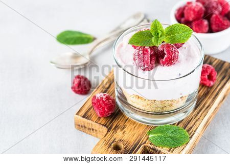 No Baked Cheesecake With Raspberry In Glass Jar. Healthy Dessert.