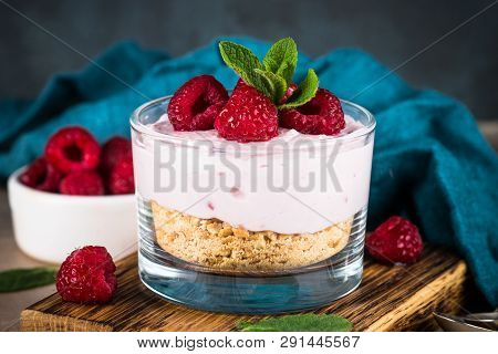 No Baked Cheesecake With Raspberry In Glass Jar. Healthy Dessert.