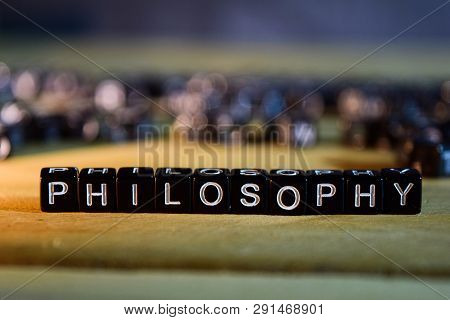 Philosophy Concept Wooden Blocks On The Table. With Personal Development, Education And Motivation C