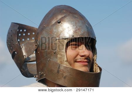 KIEV, UKRAINE - JULY 31: Member of history club Golden Capricorn wears medieval helmet as he participates in historical festival and camp in memory of King Vladimir July 31, 2009 in Kiev, Ukraine.