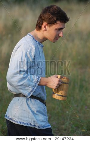 KIEV, UKRAINE - JULY 31: Member of history club Golden Capricorn wears medieval costume as he participates in historical festival and camp in memory of King Vladimir July 31, 2009 in Kiev, Ukraine.