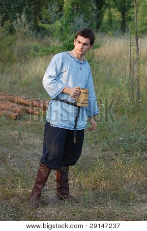 KIEV, UKRAINE - JULY 31: Member of history club Golden Capricorn wears medieval costume as he participates in historical festival and camp in memory of King Vladimir July 31, 2009 in Kiev, Ukraine.