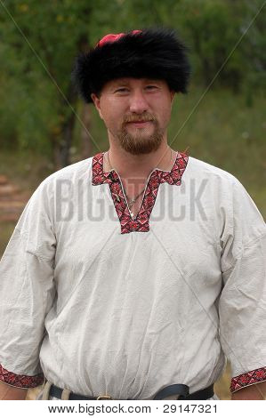 KIEV, UKRAINE - JULY 31: Member of history club Golden Capricorn wears medieval costume as he participates in historical festival and camp in memory of King Vladimir July 31, 2009 in Kiev, Ukraine.