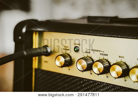 Guitar Electric Amplifier. Rock Music Overdrive Effect. Volume Control Knob Up To The Max. Shallow D