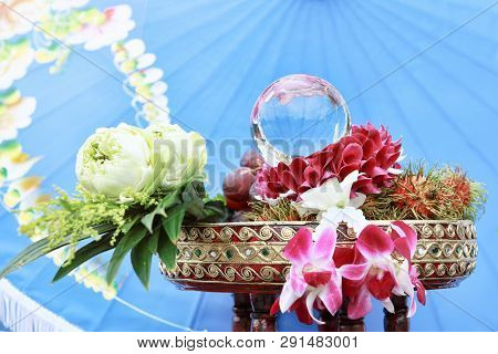 White Lotus And Orchid Garland On Thai Traditional Wooden Tray To Pay Respect To Monk Or Elder
